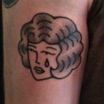 Hand poked crying lady tattoo