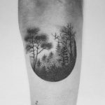 Hand poked foggy forest tattoo