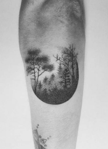 Hand poked foggy forest tattoo