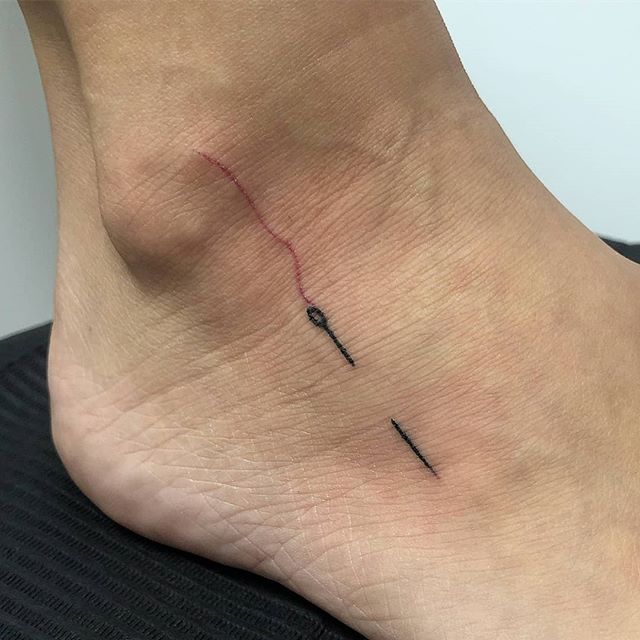 Hand poked needle tattoo