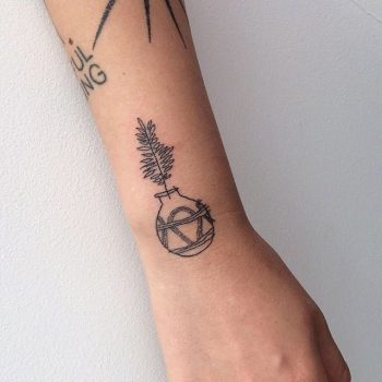 Hand poked plant pot tattoo