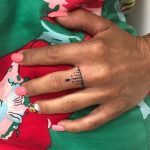 Hand poked ring tattoo