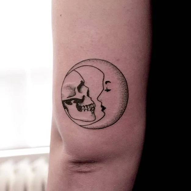 Hand poked skull and moon tattoo