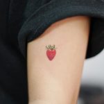 Hand poked strawberry tattoo by tattooist baka