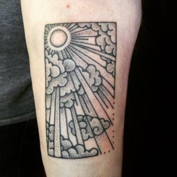 Hand poked sun bursting through the clouds