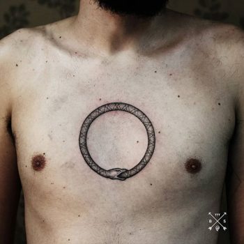 Handpoked ouroboros tattoo on chest