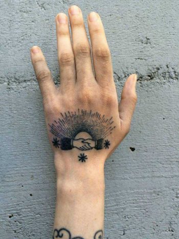 Handshake tattoo by xoïl loïc lavenu