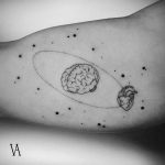 Heart orbiting brain tattoo