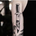 Knife and skull reflection tattoo by jonas ribeiro