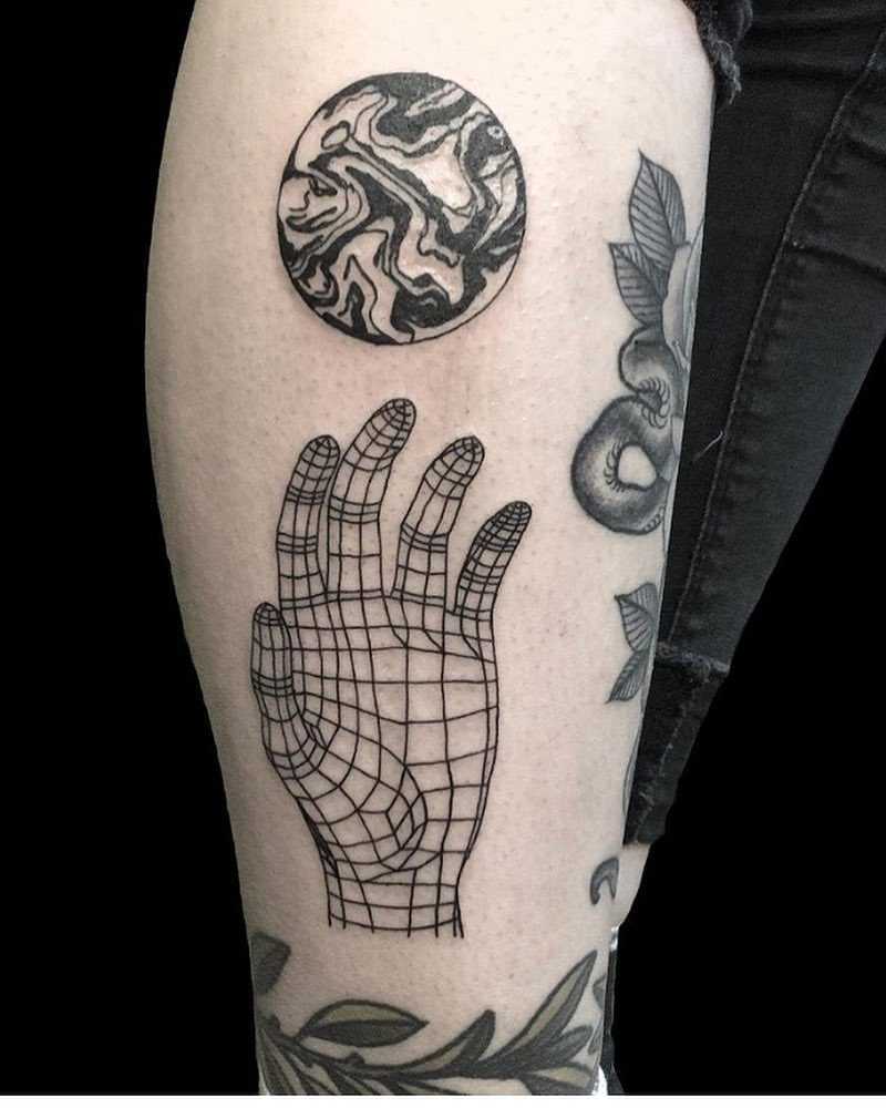 Linear hand and marble circle tattoo