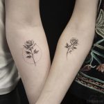 Matching rose tattoos by calvin grxsy