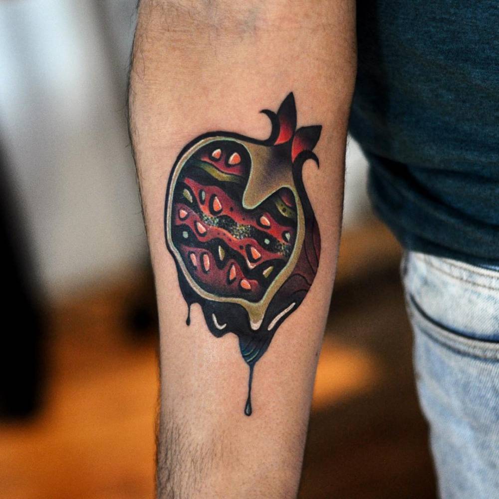 Melting pomegranate tattoo