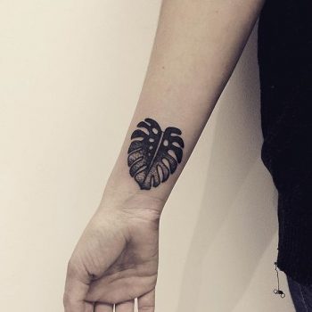 Monstera leaf tattoo hand poked by serena raccuglia