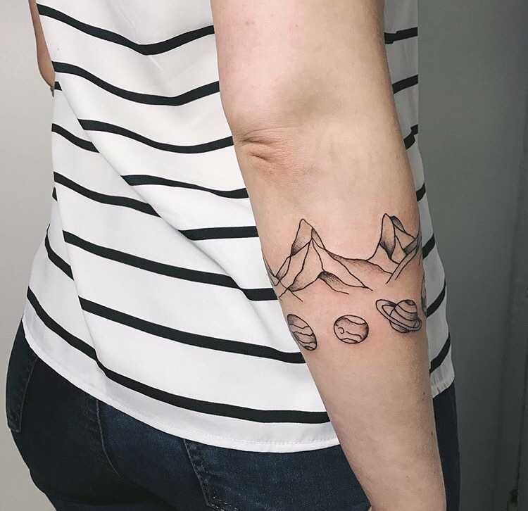 Mountains and planets tattoo by catherine harmony