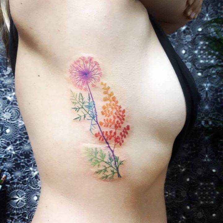 Multicolor flowers tattoo