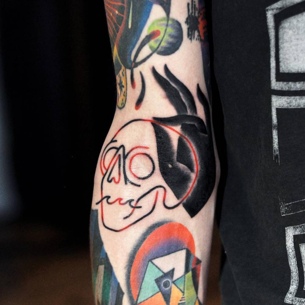 Neon skull and hand tattoo