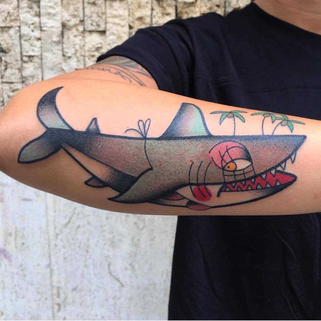 Old school shark tattoo on the forearm