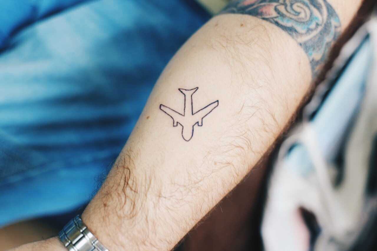 Outline airplane tattoo 