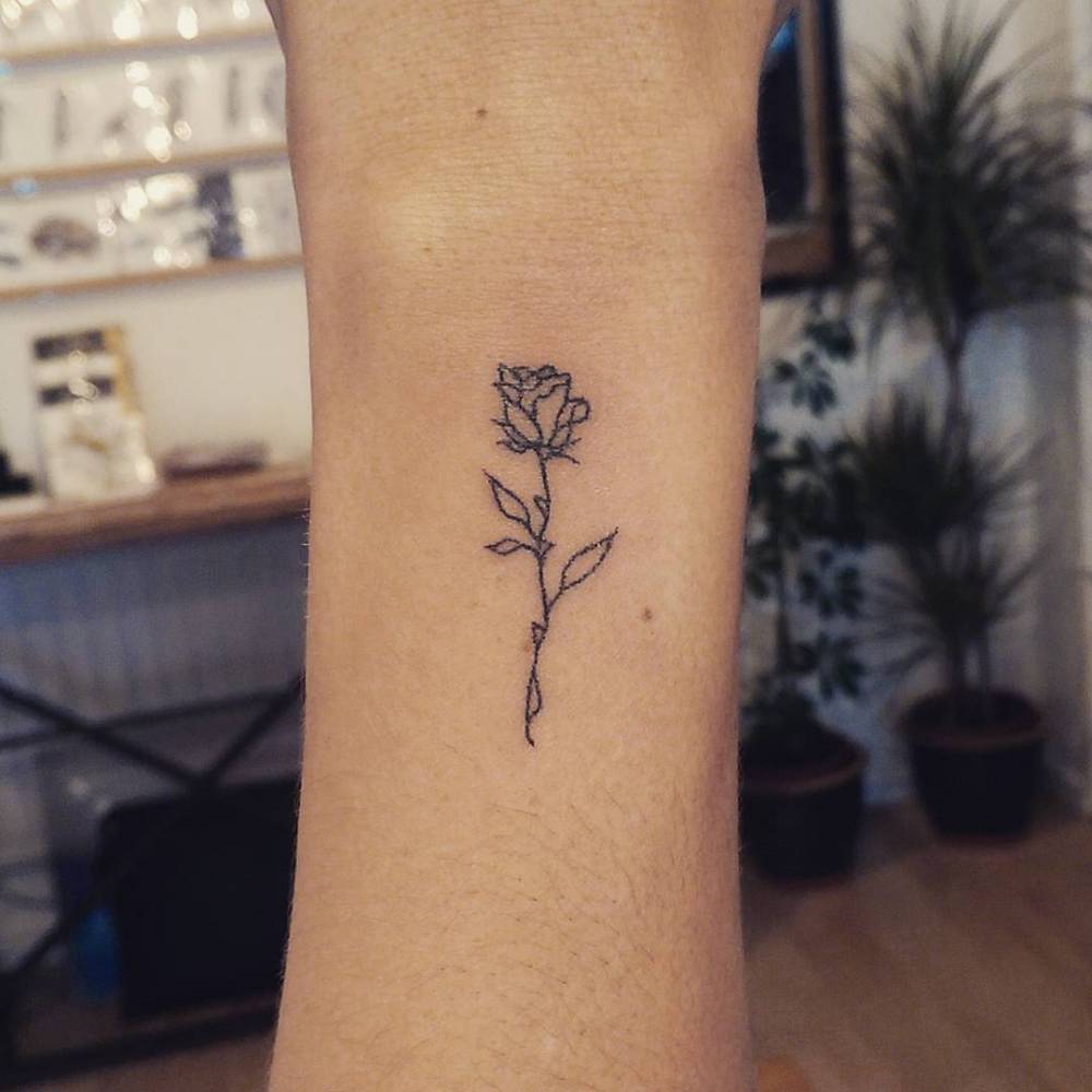 Simple outline rose tattoo