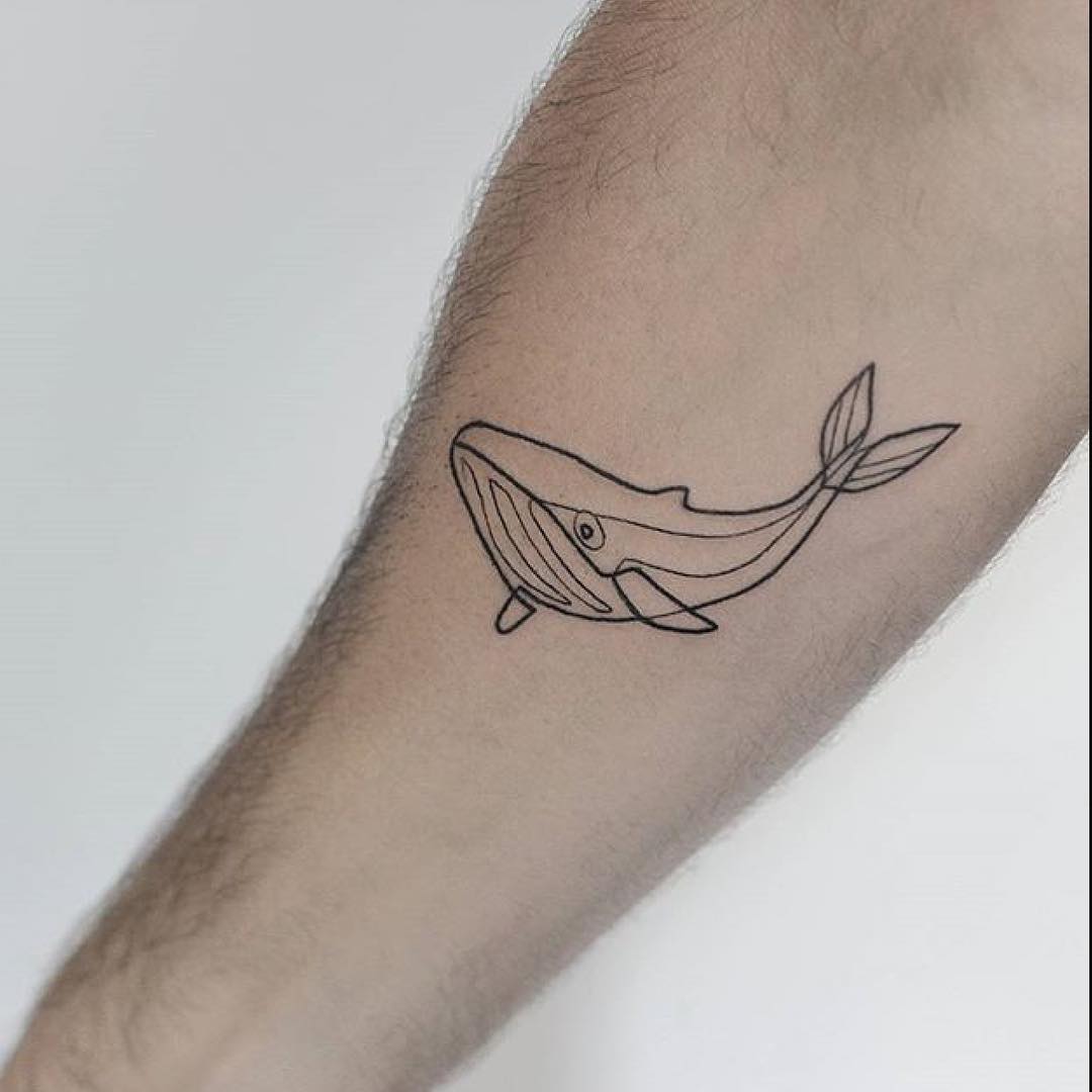Simple whale tattoo by lindsay april