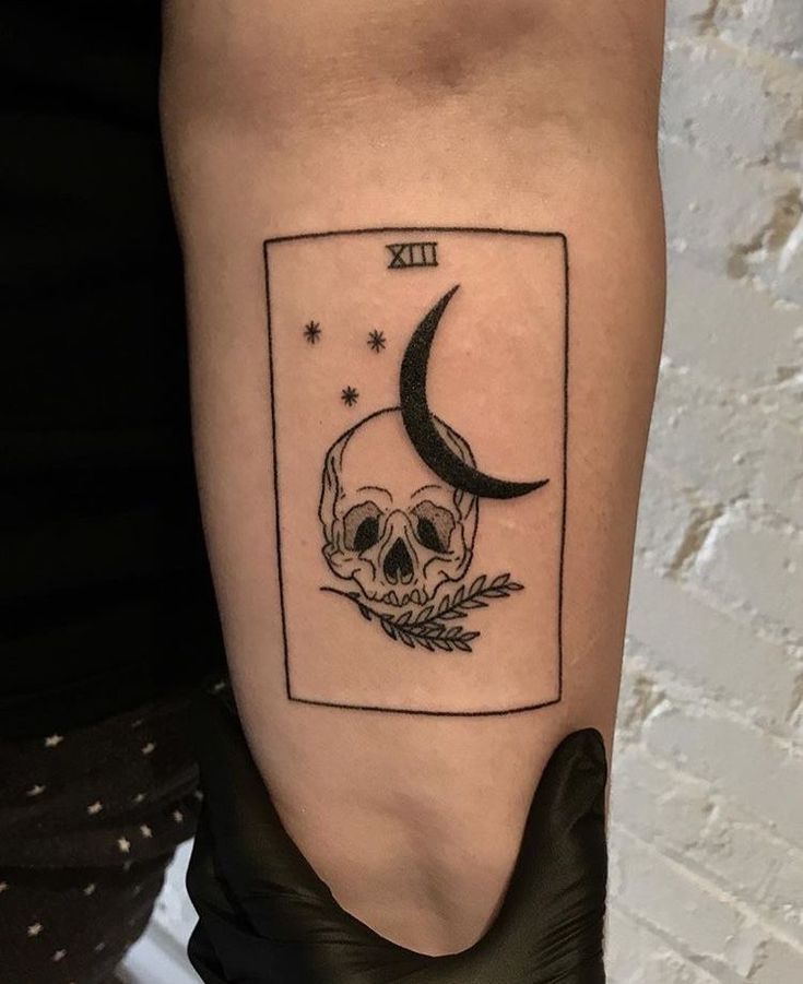 Skull and moon tarot card tattoo