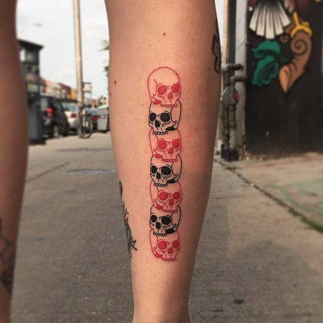 Skull pile tattoo by alex royce
