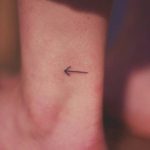 Small minimalist arrow tattoo
