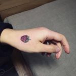 Small blackberry tattoo on the left hand