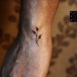 Small branch tattoo by thiago corrêa