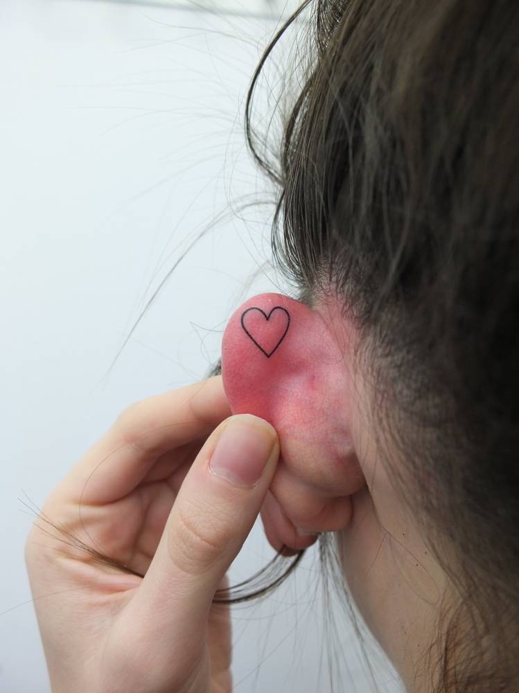 Small heart tattoo by indy voet