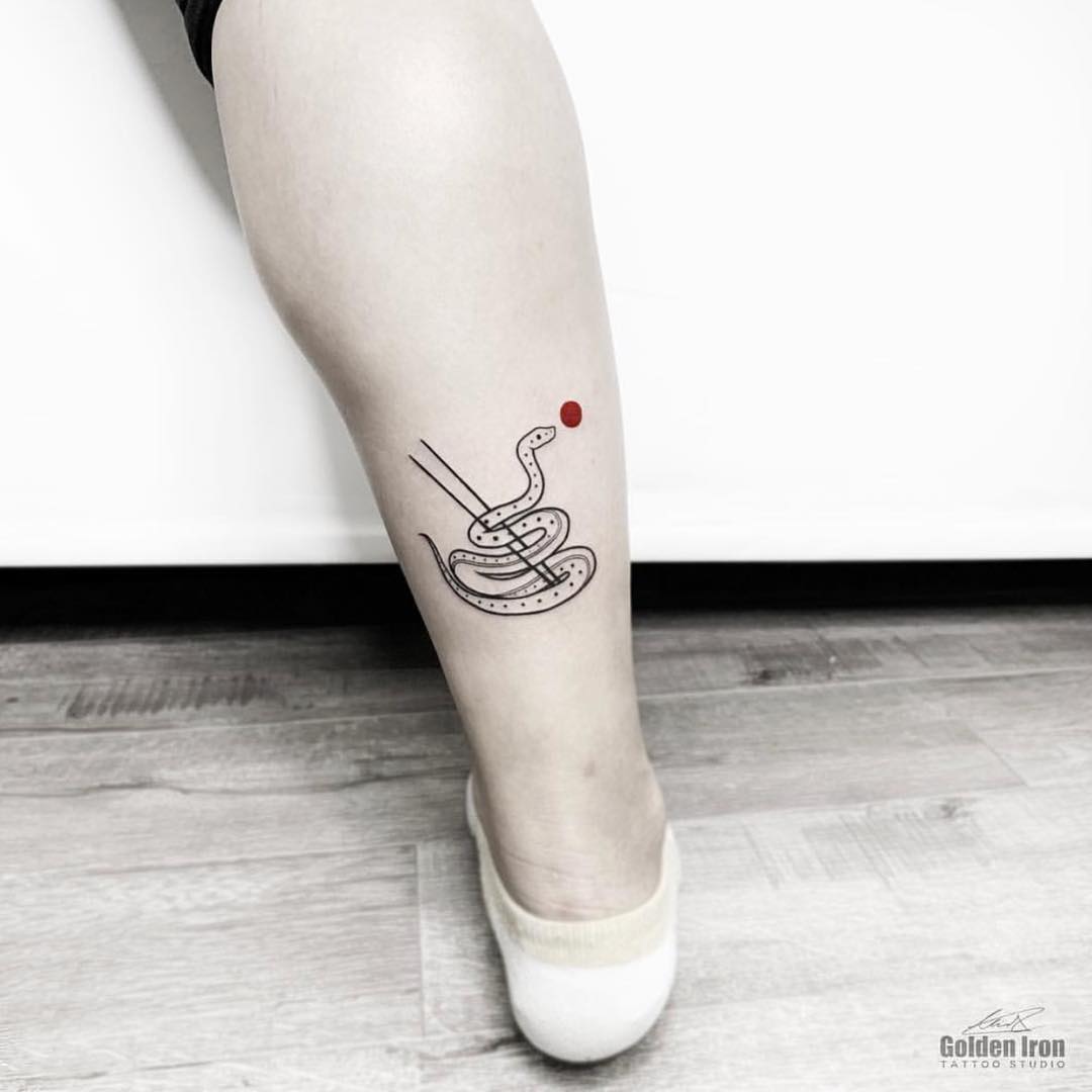 Snake and red dot tattoo by judy