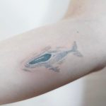 Stick and poke whale tattoo