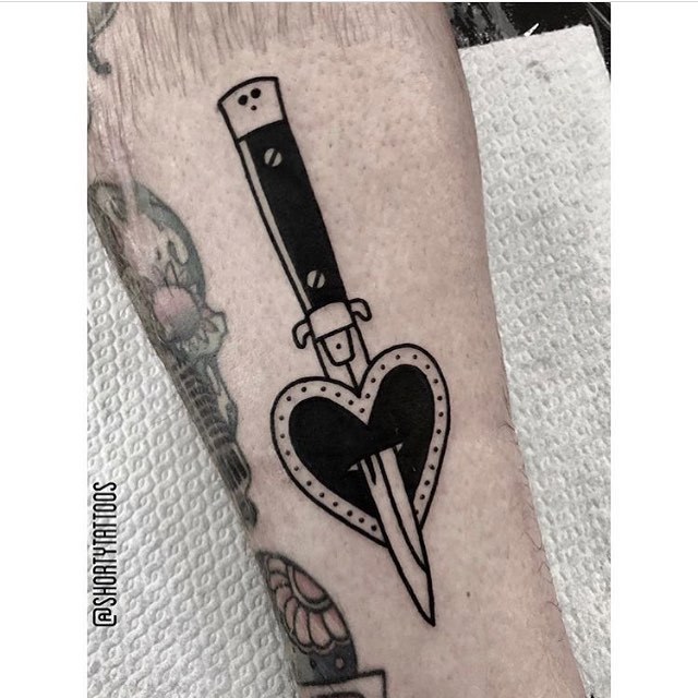 Switchblade stabbed heart tattoo by anao