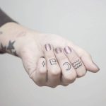 Tiny finger tattoos by nano ponto a ponto