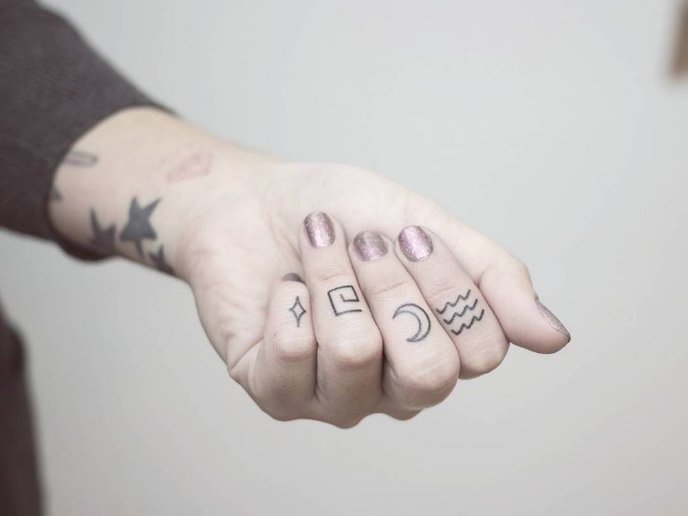 Tiny finger tattoos by nano ponto a ponto