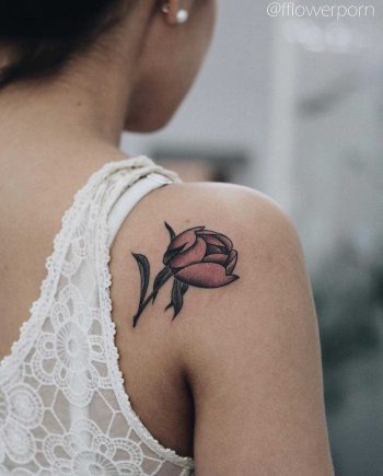 Tiny peony tattoo on the shoulder