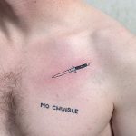 Tiny switchblade tattoo on the chest