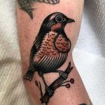 Traditional bird by breeze tattoo
