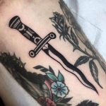 Wavy dagger tattoo by luciano calderon