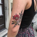 Wild rose daisy and buttercups tattoo