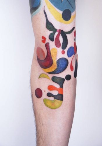 Abstract colorful tattooed arm