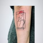 Abstract silhouette tattoo on the forearm