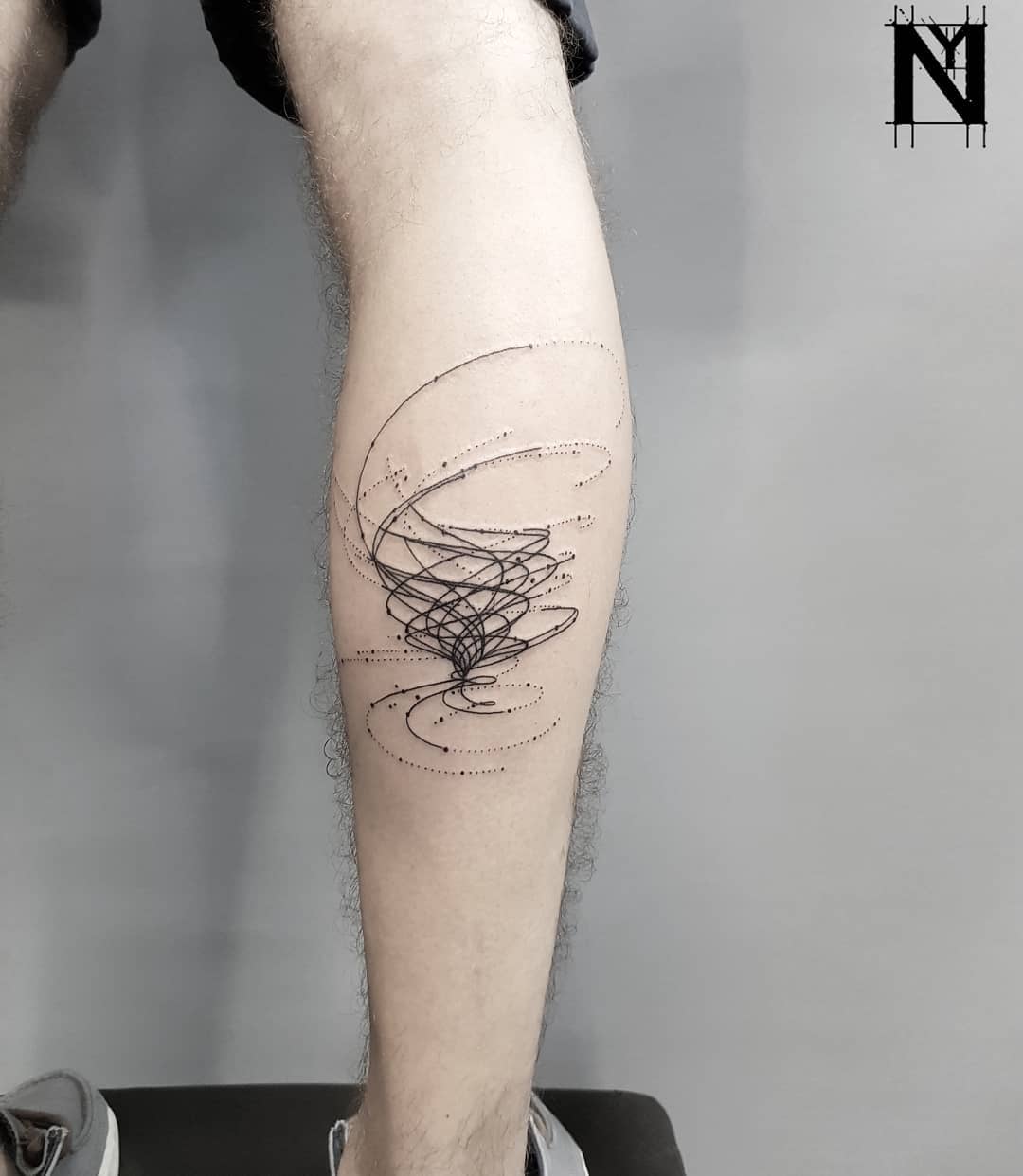 Abstract storm tattoo on the calf