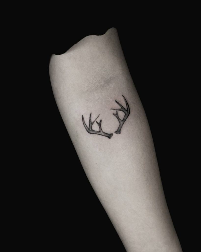 Antlers tattoo on the forearm