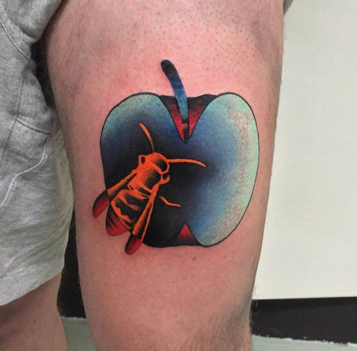 Apple and wasp tattoo