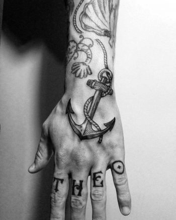 Black and grey anchor tattoo