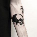 Black and white skull on the forearm