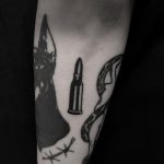 Black bullet tattoo