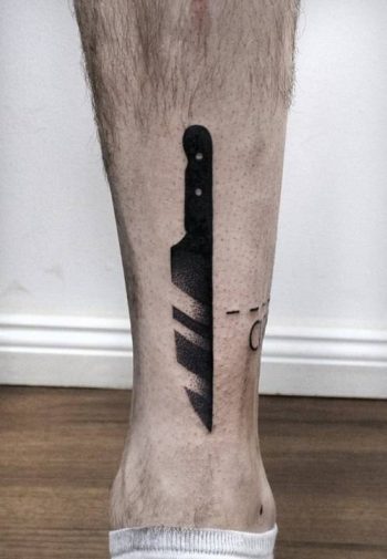Black dot-work knife tattoo