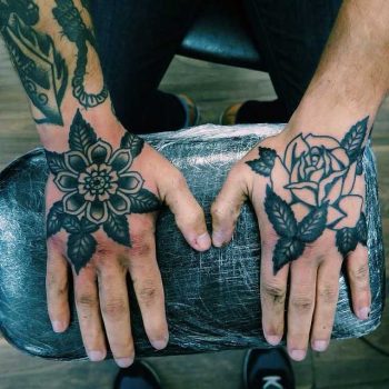 Black flower tattoos by Rich Hadley